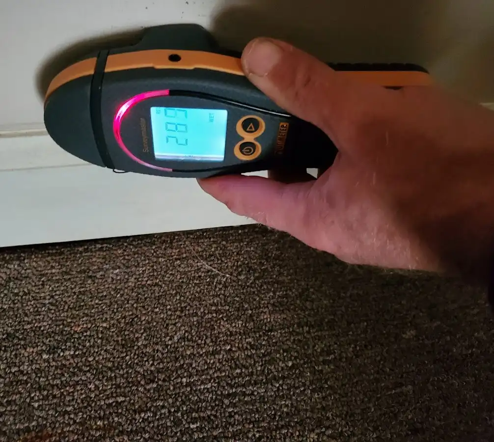 Moisture detection at baseboard during Storm Damage Restoration in Bartonville